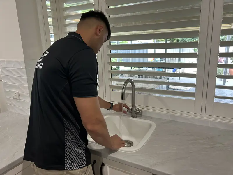 Ben installing a water filtration system